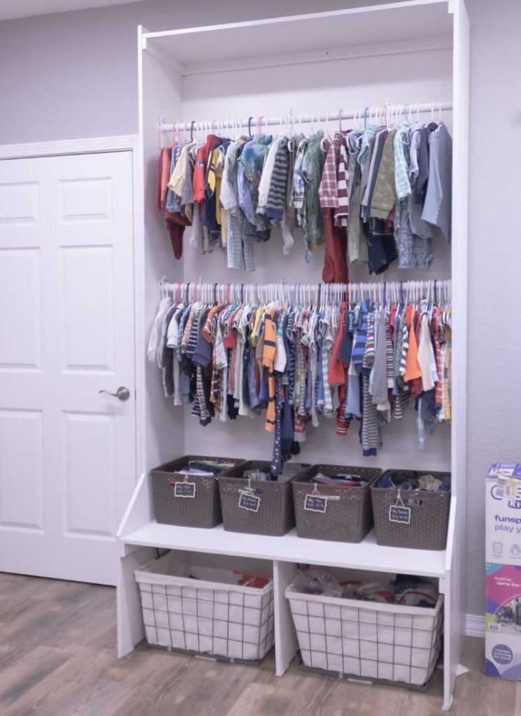Shelving system with baby clothing